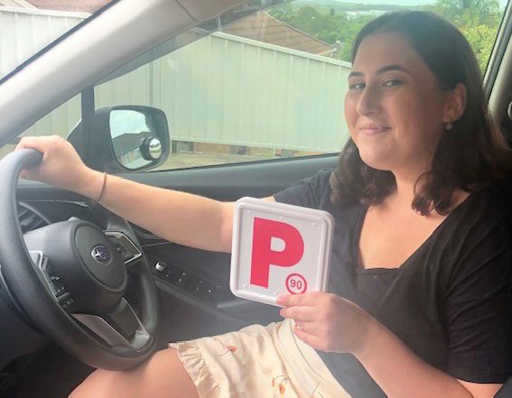 girl holding a plate with letter P